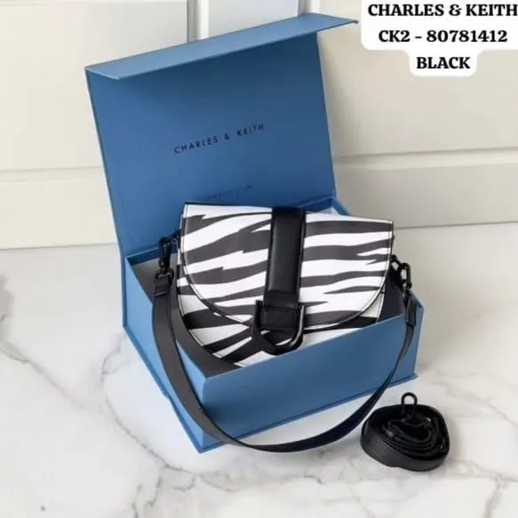 Charles & Keith Gabine Saddle Bag Zebra Print (Black)
